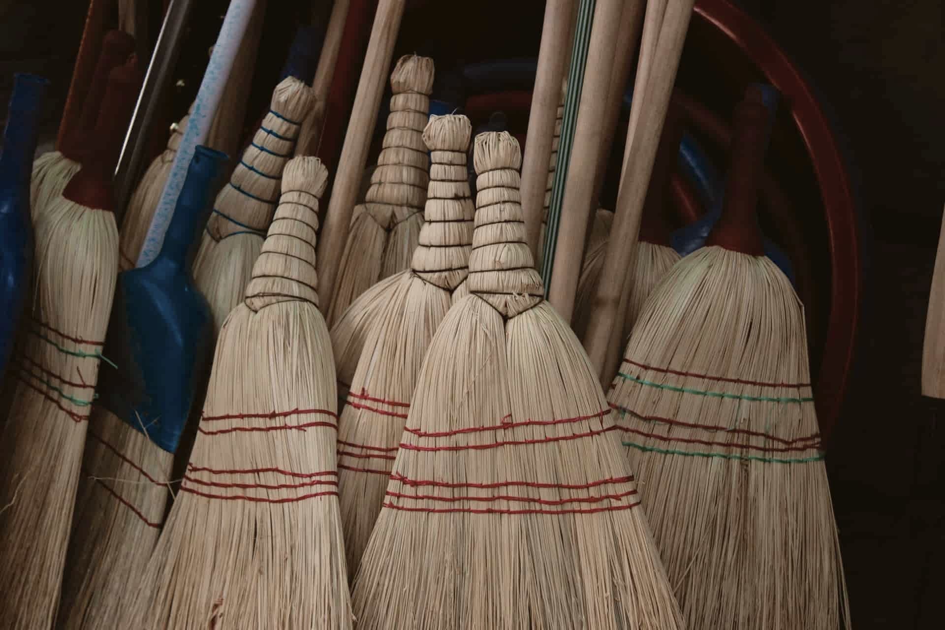 Broom bristles resting against a hard floor