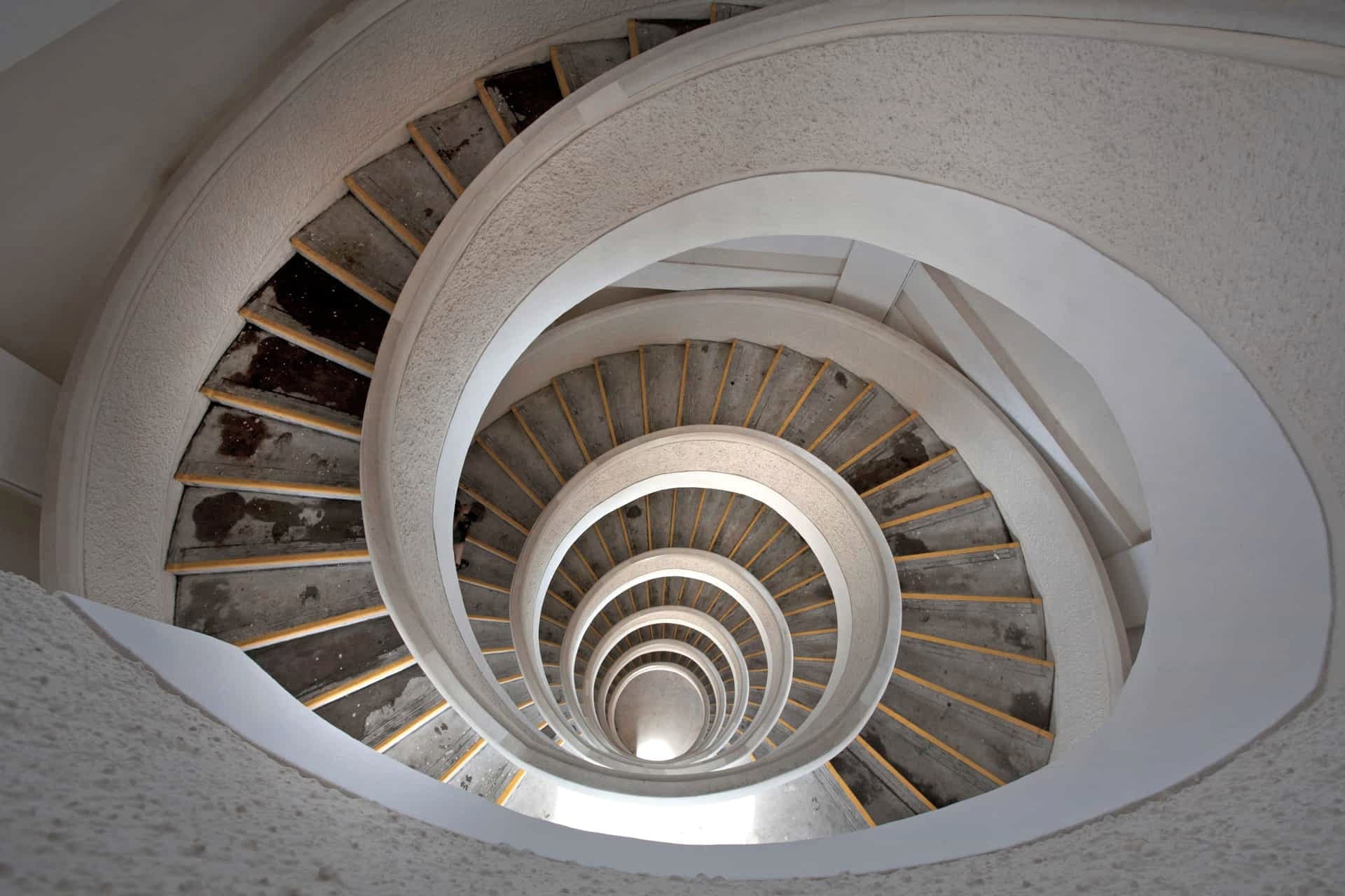 Looking down the center of a spiral staircase