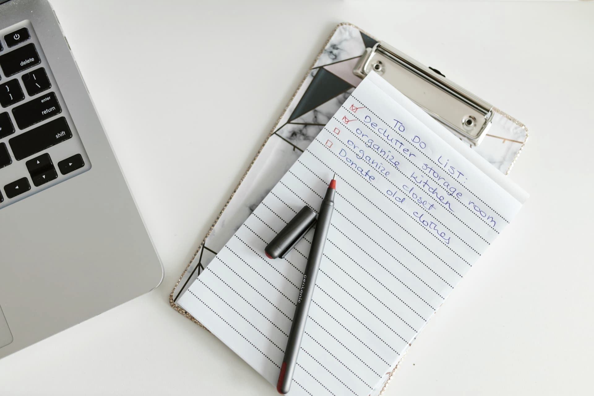A clipboard with a checklist resting on a desk